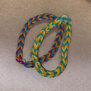 Selling: ruberband set, Colors: neon orange, pastel yellow, teal , and purple